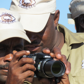 Rhino Rangers are shown holding a camera