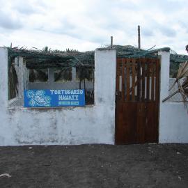 A small, simple concrete hut serves as a turtle hatchery.