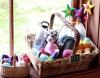 A selection of Snow Leopard Enterprises handicrafts in a wicker-basket